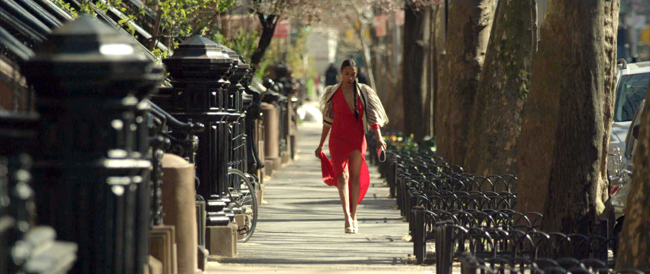 Harper walks down a Brooklyn street